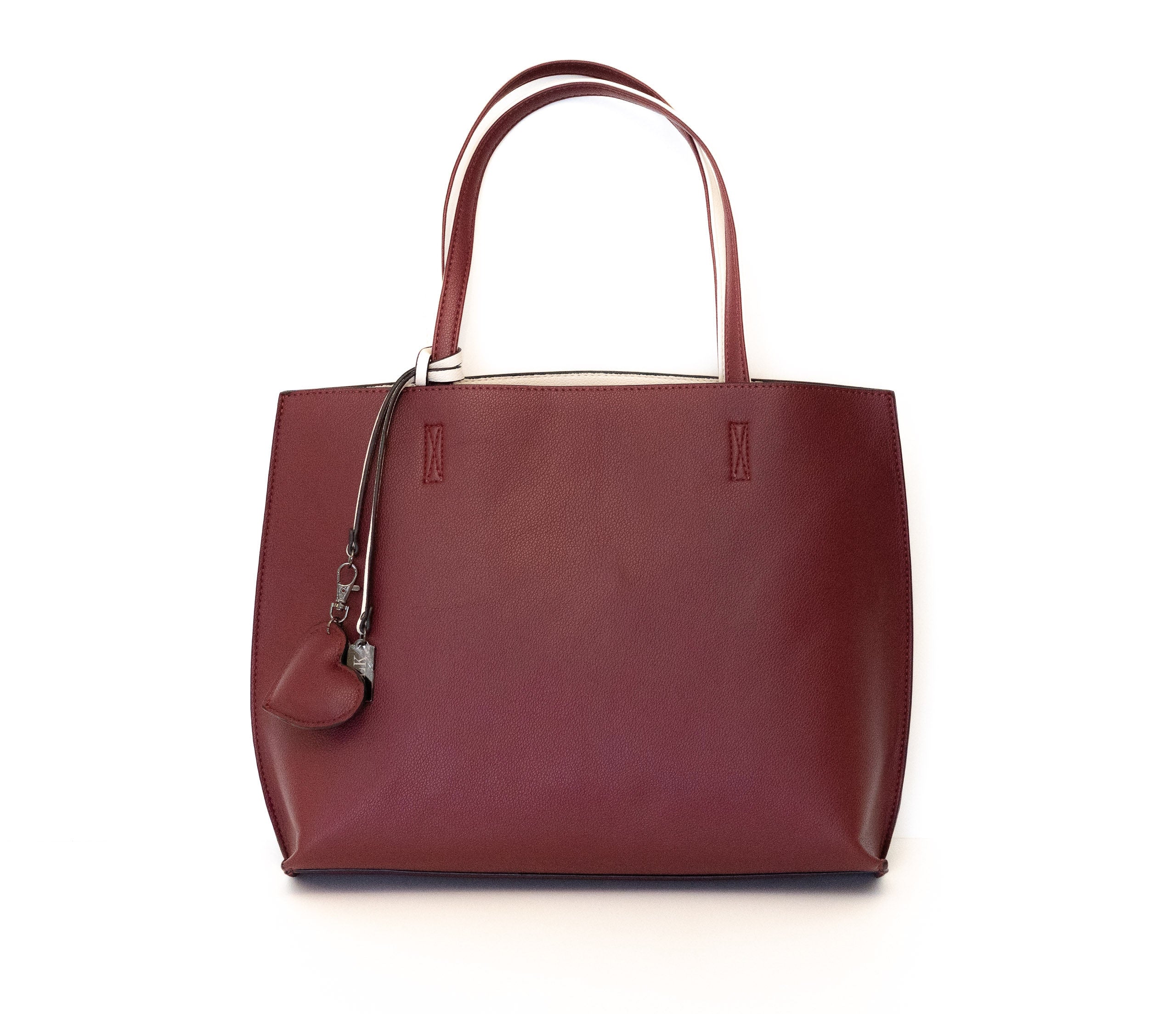 Borsa in similpelle double-face, con pochette interna fornita di tracolla.  La borsa è reversibile, quindi, può essere facilmente utilizzata in entrambi i versi.   BESTSELLER   