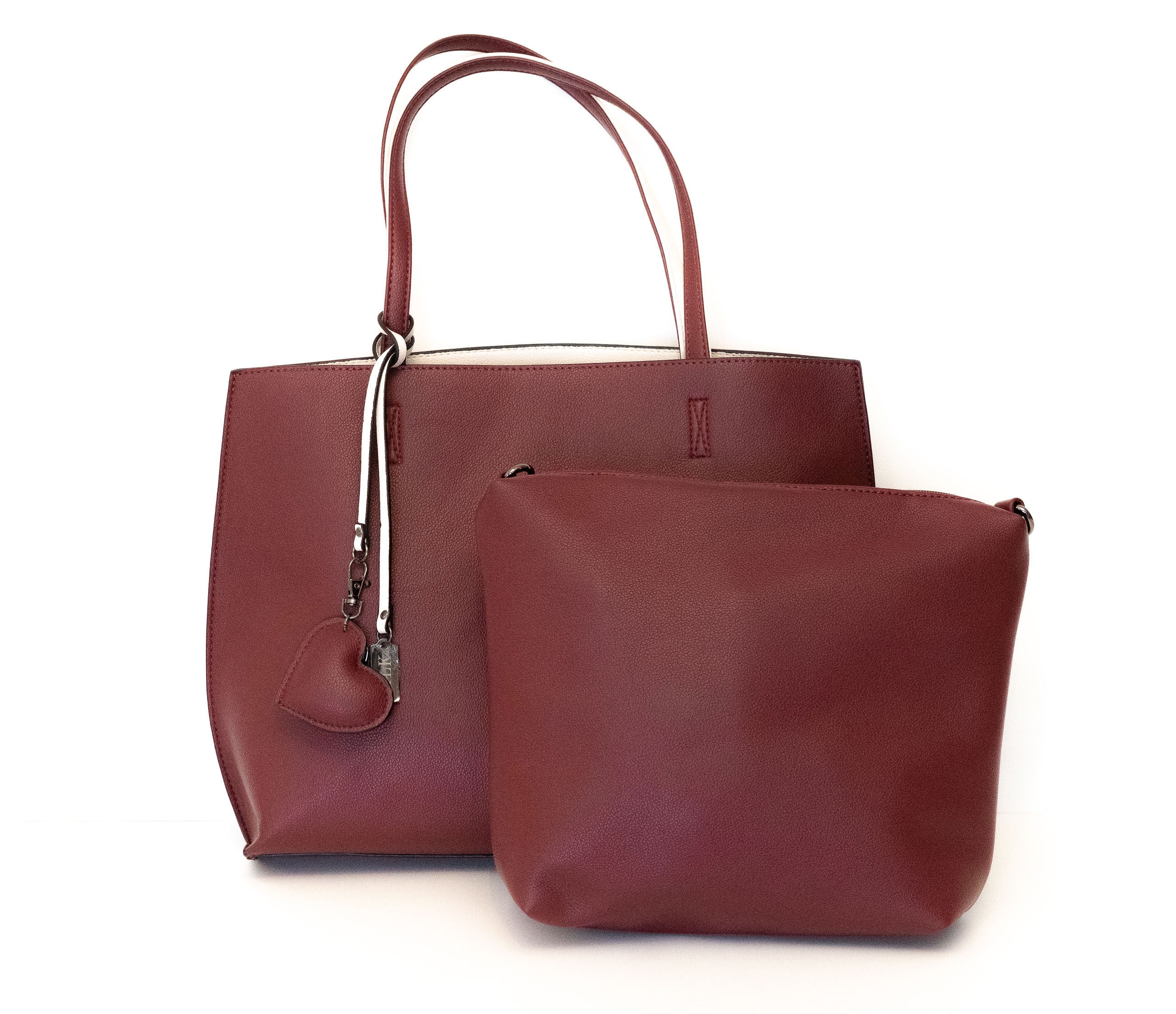 Borsa in similpelle double-face, con pochette interna fornita di tracolla.  La borsa è reversibile, quindi, può essere facilmente utilizzata in entrambi i versi.   BESTSELLER   